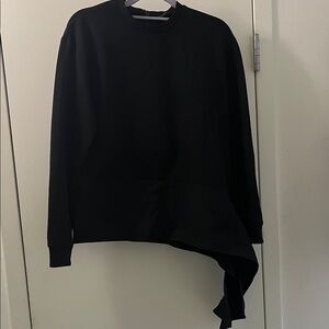 Women's top with assymetrical detail. Excellent condition.